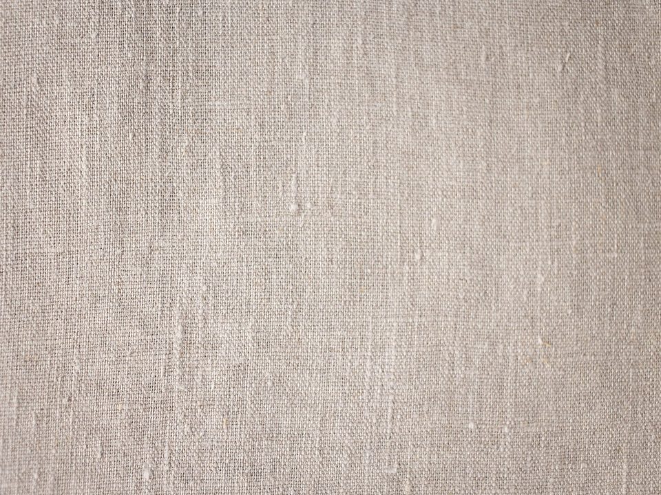 Close-up of neutral linen fabric texture