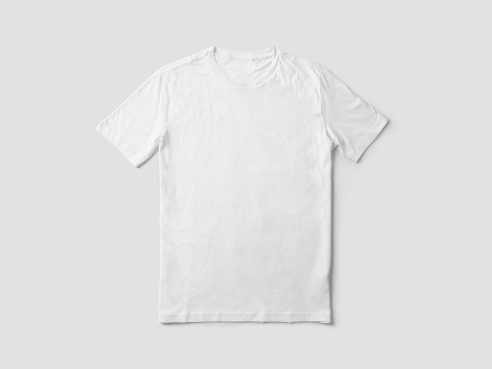 Plain white T-shirt laid flat on a light neutral background